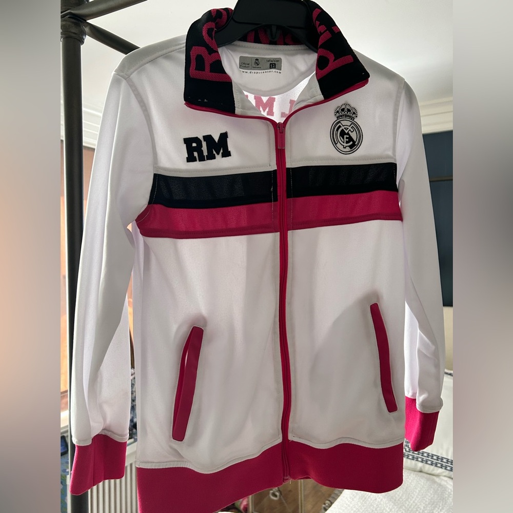 Official Product of Real Madrid FC!  White and pink zip up.